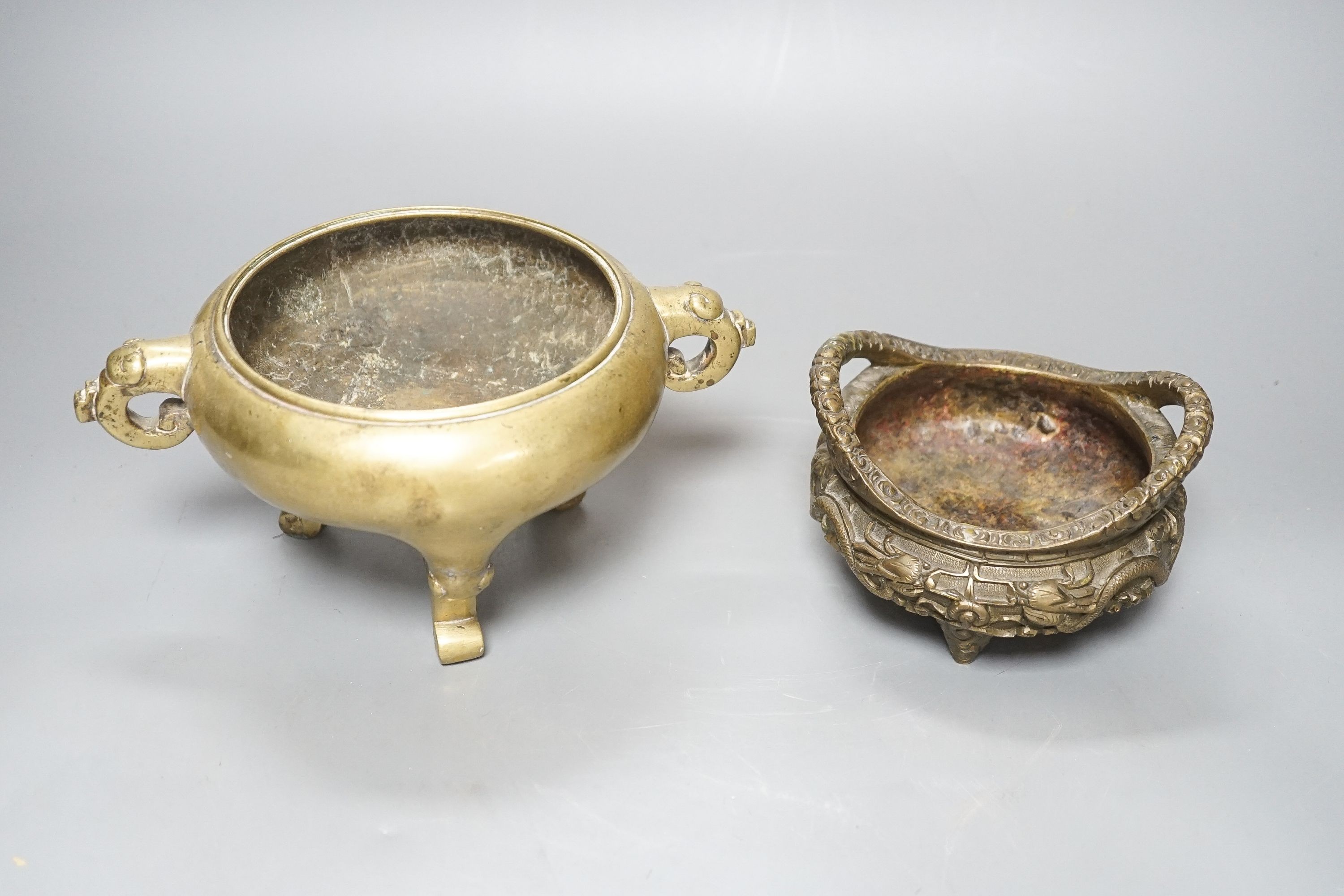 Two Chinese bronze tripod censers, Xuande marks but early 20th century, largest 21cm wide